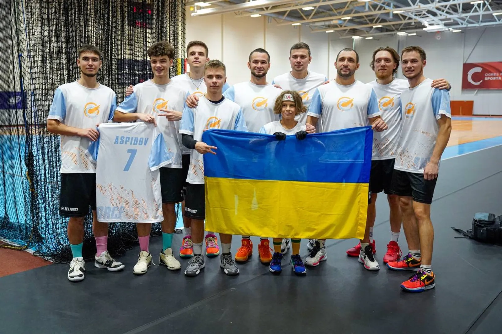 Boys hold the Ukrainian flag after a medal.