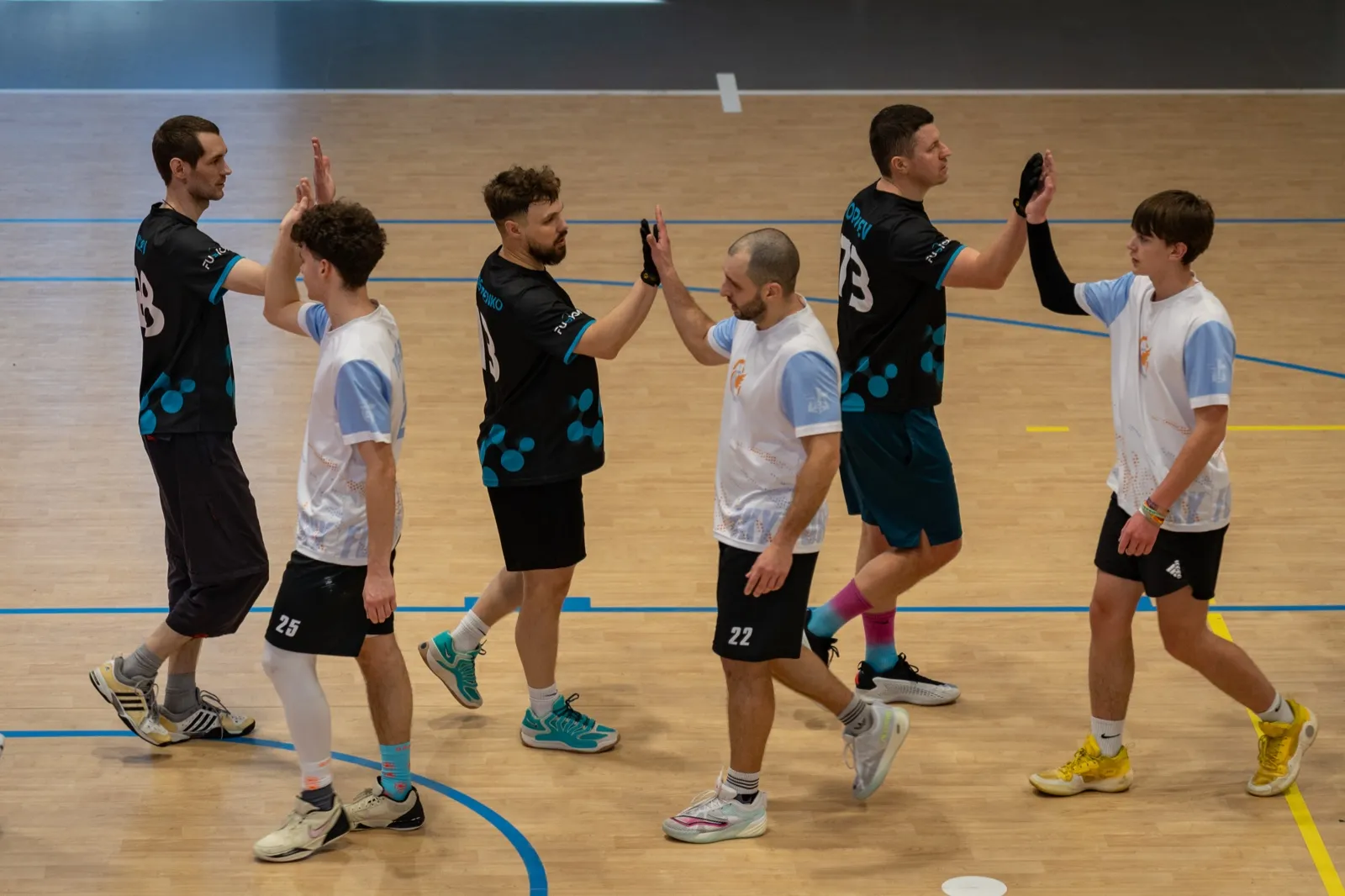 Players exchanging high-fives in a line.